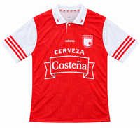 Front of the red nineties Santa Fe Adidas retro jersey, white sleeves, polo collar and Cerveza Costeña on the chest