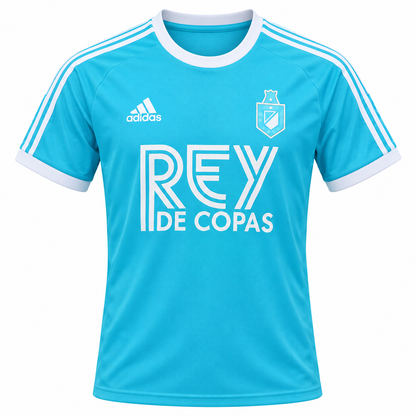 Camiseta celeste del Atlético Nacional con Rey de Copas al pecho y el escudo de antes