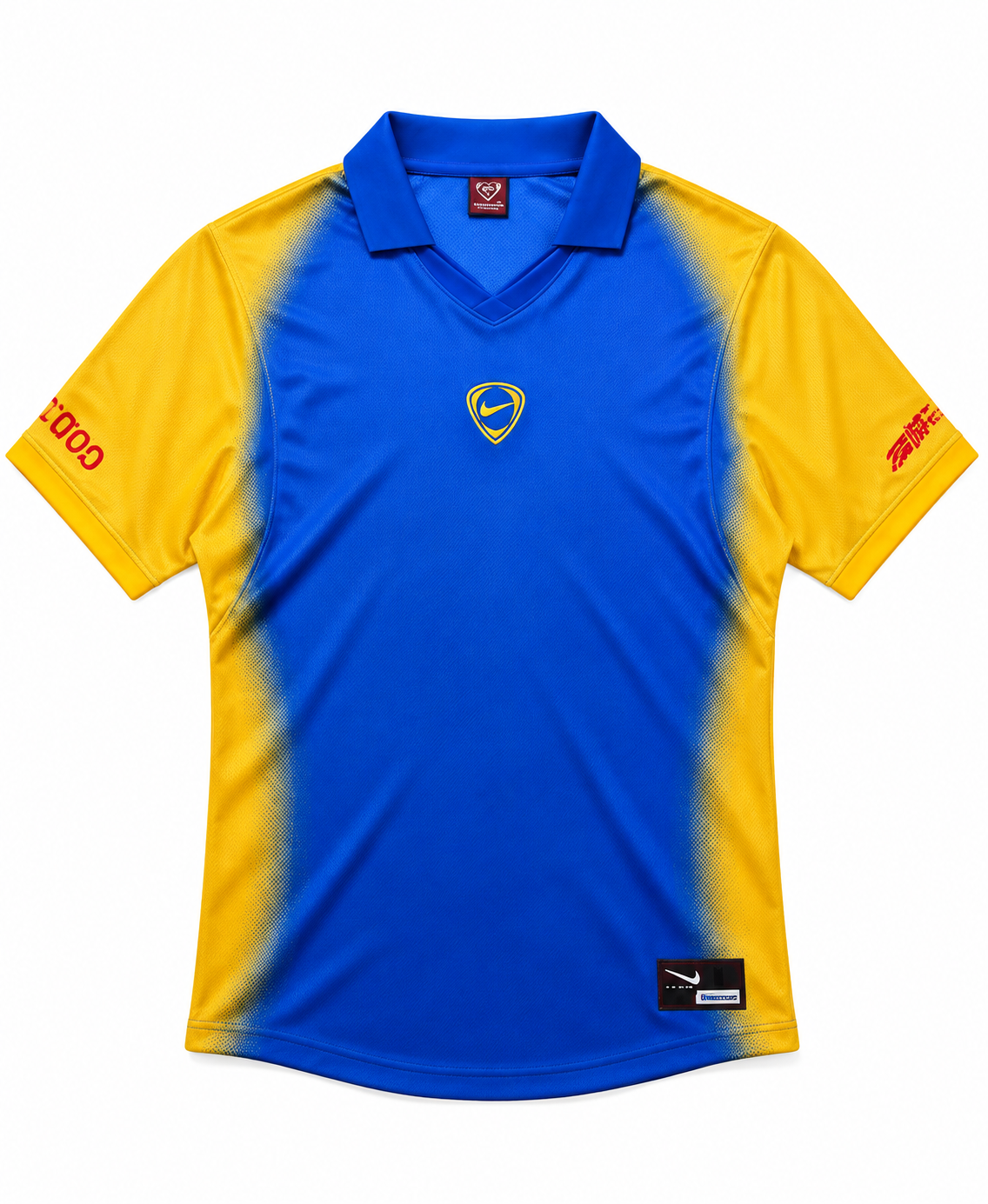 Front of the Colombia Total 90 jersey, blue with yellow sleeves, a polo collar and the Total 90 shield