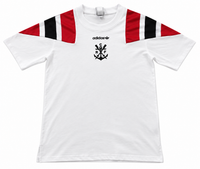 Front of the white Flamengo shirt with red and black shoulders, the Adidas trefoil and the anchor emblem with CRF
