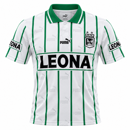 Front of the white Atlético Nacional retro jersey by Puma, with green stripes, Leona on the chest and polo collar