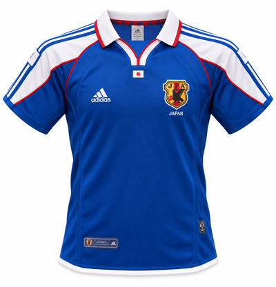 Camisa retrô azul do Japão 2000 com gola polo branca, ombros brancos e o escudo da JFA