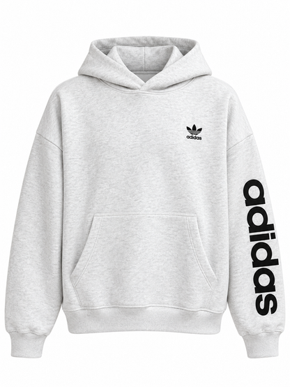 Hoodie gris Adidas Originals con el trébol al pecho, de frente