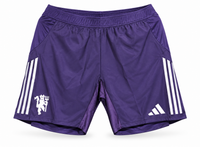 Purple Manchester United shorts with three white stripes and the devil, the crest and the Adidas logo
