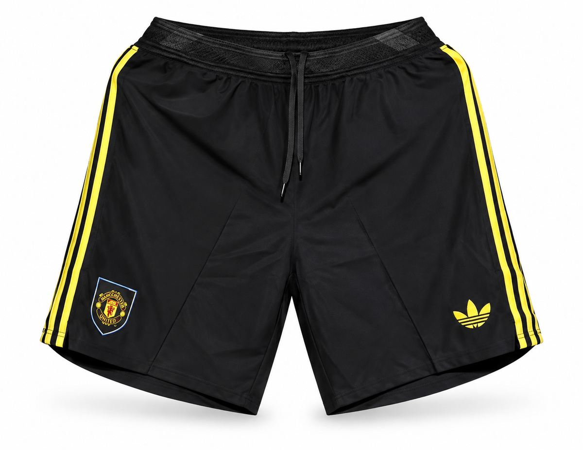 Black and yellow Manchester United shorts with three yellow stripes, the crest and the Adidas trefoil