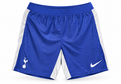 Pantaloneta azul del Tottenham con paneles blancos a los lados, escudo y el logo de Nike